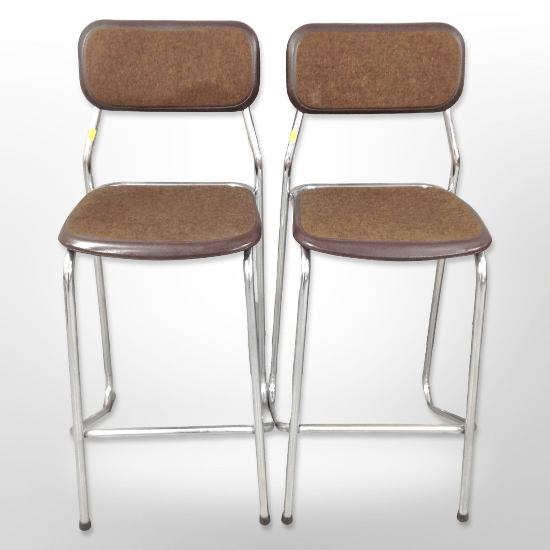 A pair of contemporary chrome-framed bar stools marked 'Made in Holland', height 94cm.
