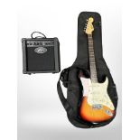 A 2003 Squier by Fender electric guitar in Fender carry bag,