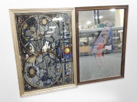Two picture mirrors, one depicting a map of the world, the other with Pepsi-Cola advertising,