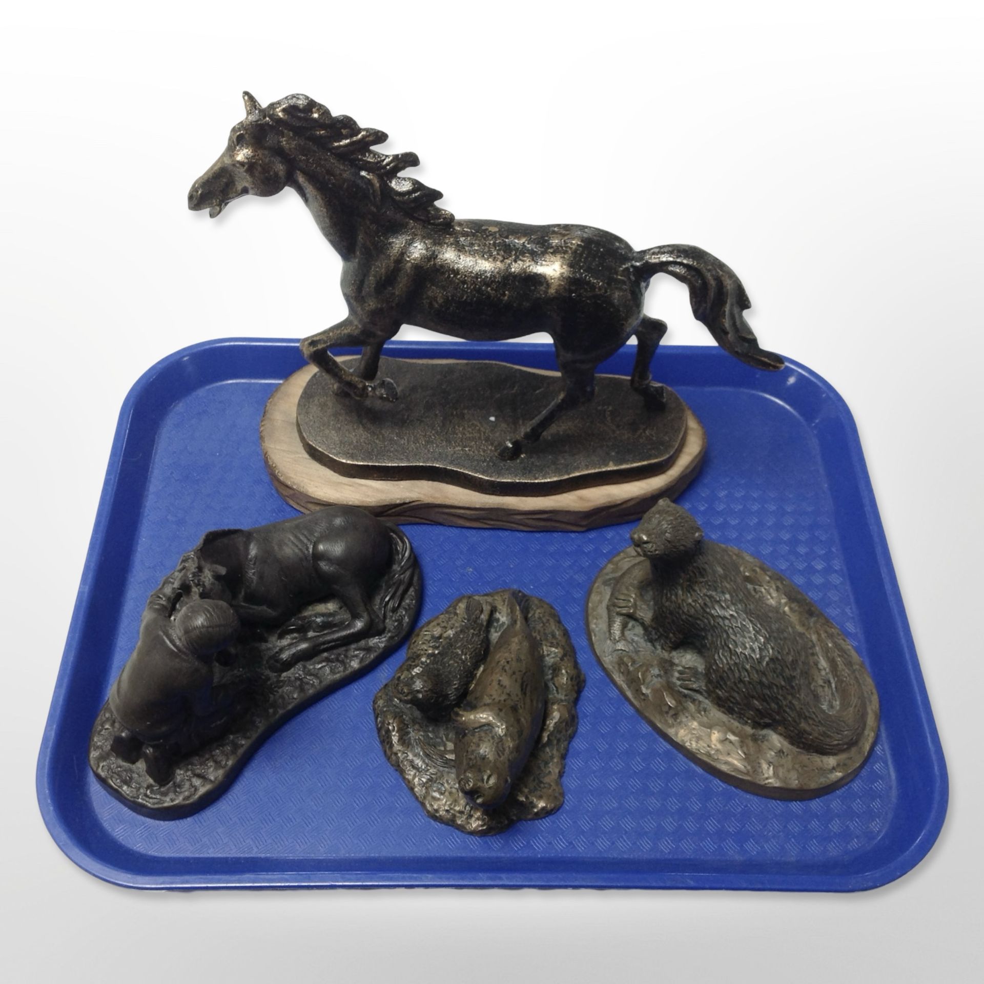 A cast-iron figure of a horse on wooden plinth, height 19cm,