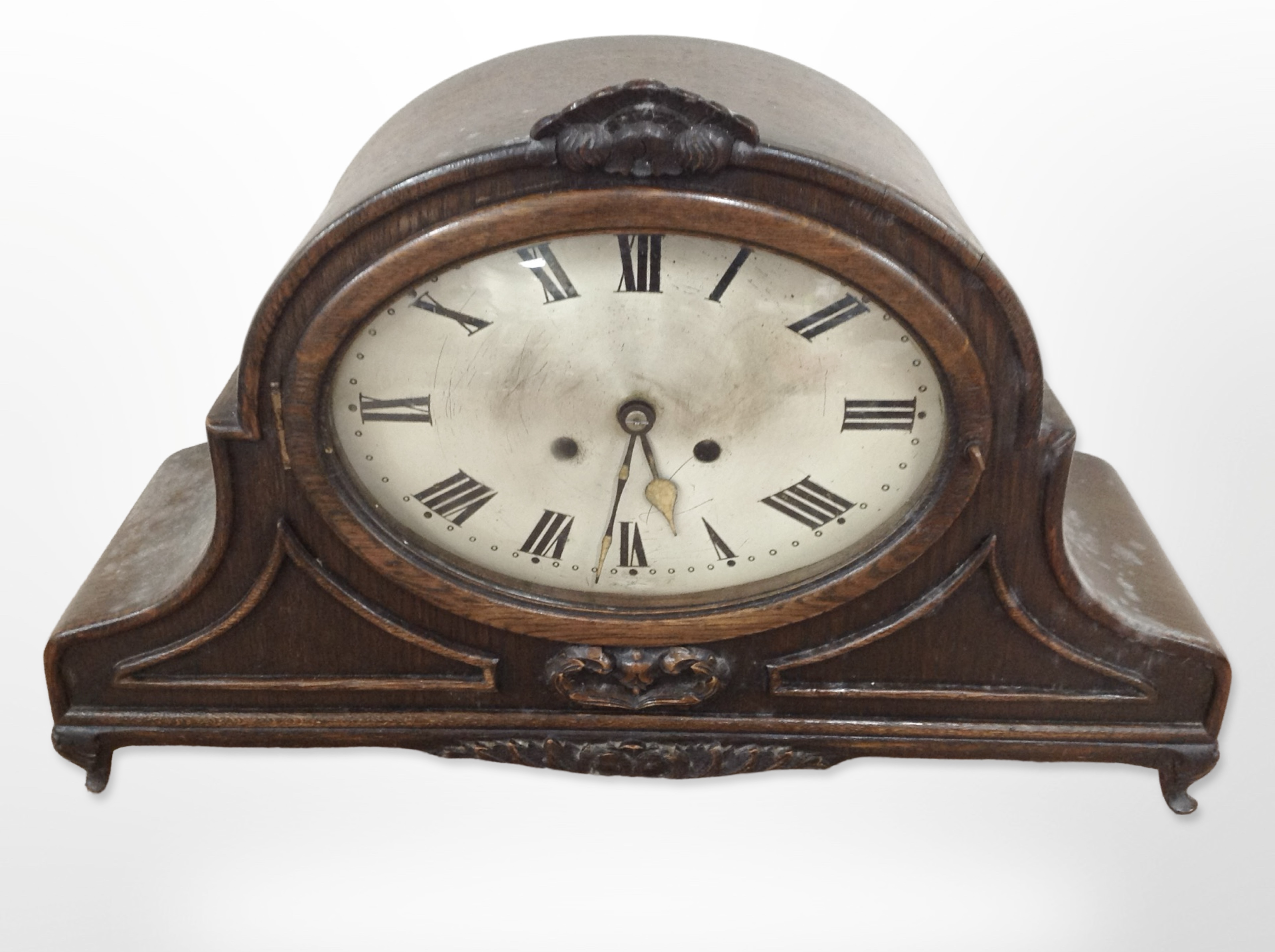 A late Victorian oak mantel clock with silvered dial, height 33cm,