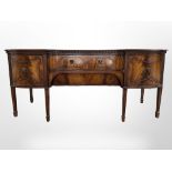 An early 20th century mahogany inverted bowfront serving table, by Gill & Reigate of London,