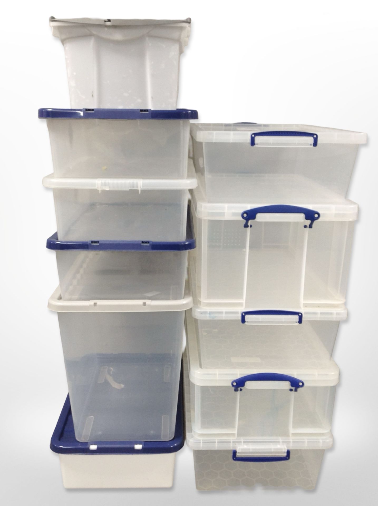 Eleven assorted plastic storage boxes with lids.
