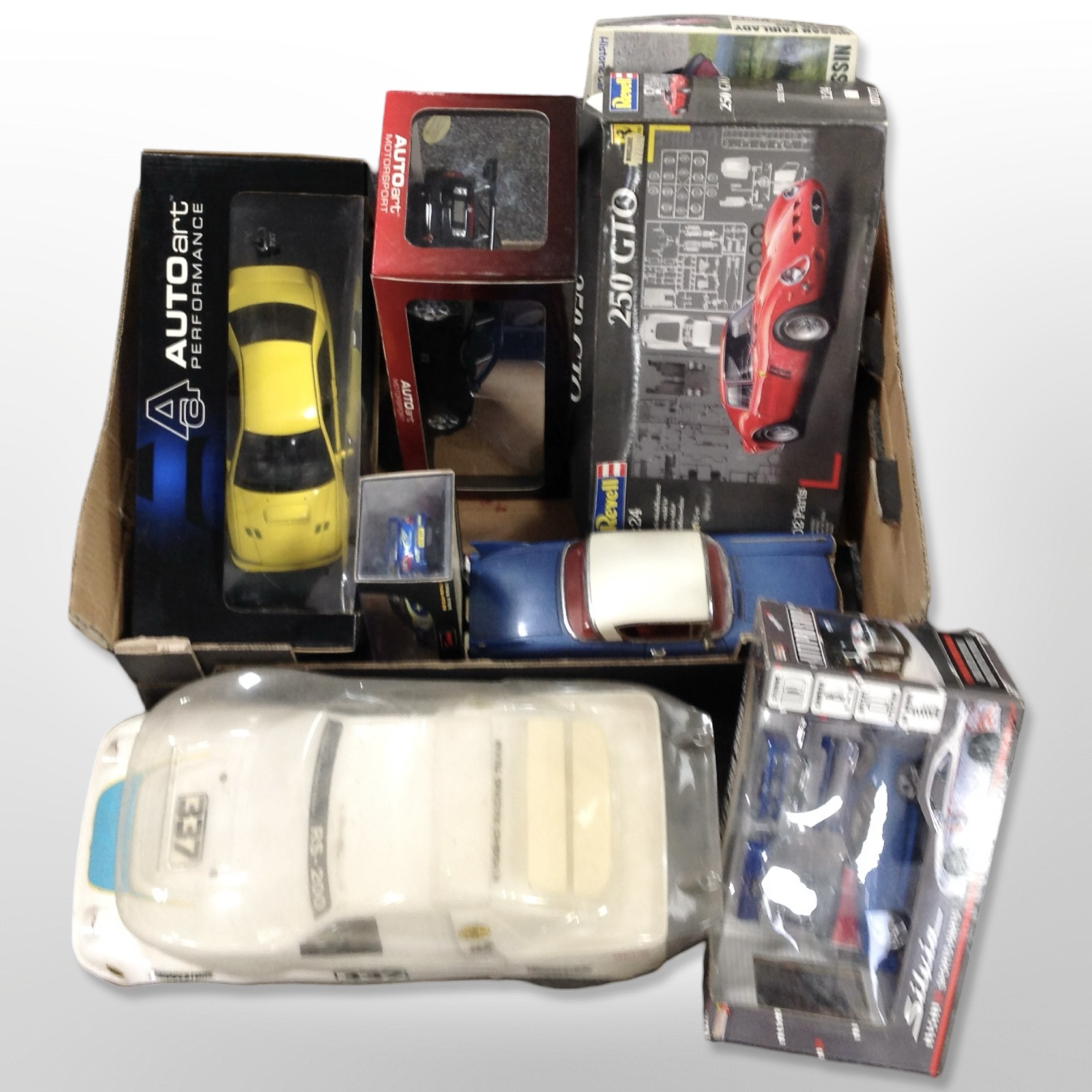 A group of mainly boxed die-cast model cars including Revell, Hotworks, Hobby Kits, etc.