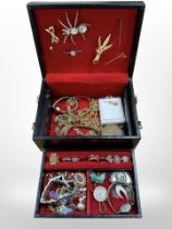 A jewellery box of assorted dress rings, gent's Hugo Boss wristwatch, brooches,