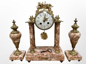 A French ormolu and pink marble three-piece portico clock garniture,