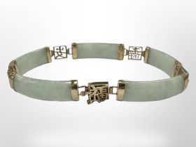 A 9ct gold mounted jade bracelet, length 18.5cm CONDITION REPORT: 11.