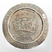 A Continental silver on copper charger decorated with figures and camels, diameter 39.