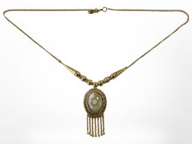 A Continental yellow metal necklace with cabochon stone pendant, stamped 875.