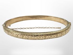 A 9ct yellow gold bangle, 57 mm x 48 mm internally. CONDITION REPORT: 8g.