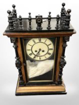 A part-ebonised late-Victorian wooden mantle clock, together with a barometer.