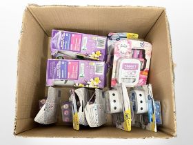 A box of Febreze plug in air scents and Air Wick fragrance Life Scents
