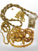 Seven strands of yellow and butterscotch amber/bakelite beads