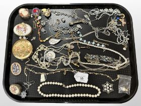 A group of costume jewellery, necklaces, compact,