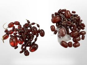 Two red amber/bakelite bead necklaces,