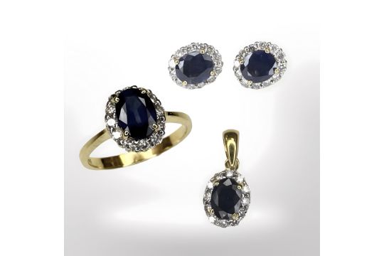 An 18ct gold sapphire and diamond cluster ring with matching pendant and pair of earrings ensuite,