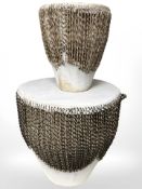 Two African hide drums, tallest 39 cm.