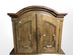 An early 19th century oak domed double door cabinet top, 96 cm x 31 cm x 84 cm.