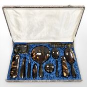 A tortoise shell effect dressing table set in case
