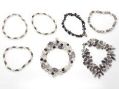 A group of freshwater pearls and amethyst bracelets, some with gold plated beads,