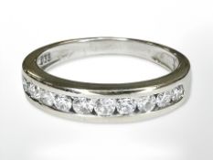 An 18ct white gold diamond half eternity ring, size I/J, approximate 0.3ct.