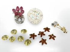 A group of decorative Swarovski crystal and glass ornaments including coloured crystal flower,
