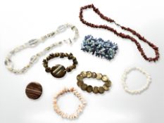 Eight items of jewellery inlcuding bracelet with agate slice, shell cuff bracelet,