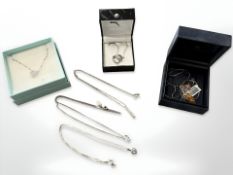 A group of Sterling silver jewellery including pendants on chains, amber pendant on chain,
