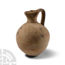 Cypriot 'Eyed' Trefoil Mouthed Pottery Jug with Swastikas