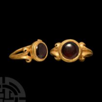 Roman Gold Ring with Garnet Cabochon