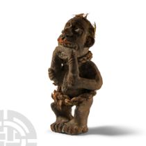 Ethnographic Terracotta Figure Biting a Rope