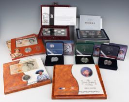 A small group of Elizabeth II Royal Mint silver proof coins and collectors’ packs, including two