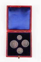 An Edward VII four-coin Maundy set 1902, within original gilt-tooled red leather case.Buyer’s