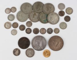 A George V half-sovereign 1914, a Victoria Jubilee Head crown 1890, a George V crown 1935 and a