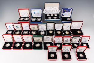 A large collection of Elizabeth II Royal Mint silver proof piedfort commemorative coins, including a