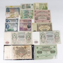 A large collection of European and world banknotes, including Russia, Spain, Germany and Kenya.