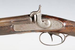 An early/mid-19th century double-barrelled percussion shotgun, barrel length 77cm, with foliate-