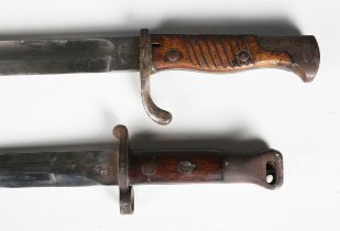 A Victorian 1894 pattern bayonet with straight double-edged blade, blade length 30.5cm, and wood