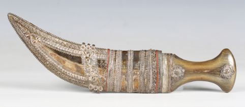 An early/mid 19th century Middle Eastern jambiya with typical curved ribbed blade, blade length