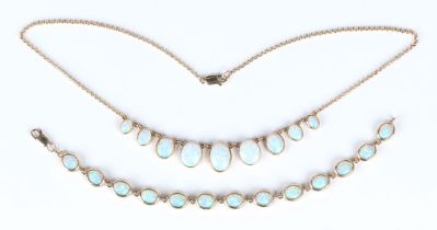 A 9ct gold and synthetic opal necklace, collet set with a row of graduated oval synthetic opals,