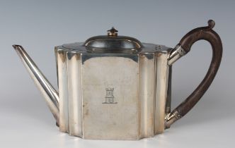 A George III silver teapot, the front engraved with a castellated tower crest, London 1790 by