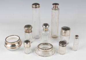 A group of ten various silver mounted cut glass dressing table bottles and jars.Buyer’s Premium 29.