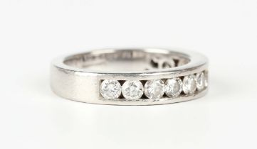 A Garrard platinum and diamond half eternity ring, mounted with a row of twelve circular cut