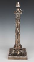 An Edwardian silver Corinthian column candlestick, the slightly tapered cylindrical stem monogram