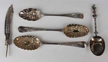 A pair of George III Irish silver tablespoons, each oval bowl later decorated in relief with flowers