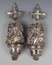 Two Italian silver holy water fonts, each embossed with Christ and cherub, total weight 106.6g,