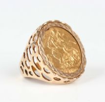 A 9ct gold ring, mounted with an Edward VII sovereign 1910, weight 12.6g, ring size approx N1/2.