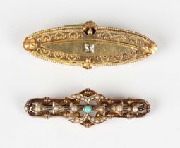 A gold and diamond oval brooch, mounted with a cushion cut diamond, otherwise with applied bead