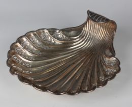 A late Victorian silver dish of scallop shell form with pierced and engraved decoration, Sheffield