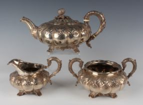 A George IV silver three-piece tea set, comprising teapot, milk jug and sugar bowl, each of lobed